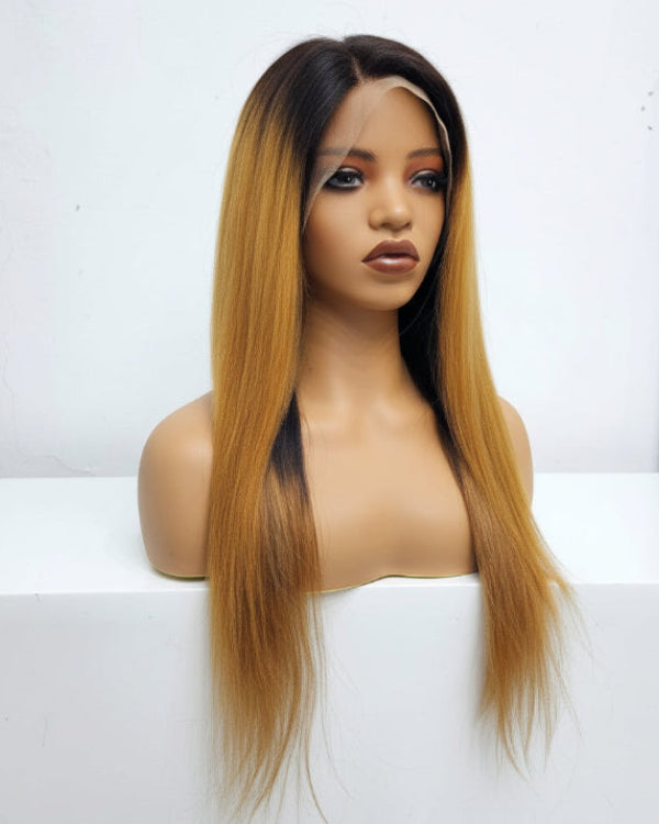 Close-up of black and brown lace front wig displaying straight human hair texture and honey blonde gradient