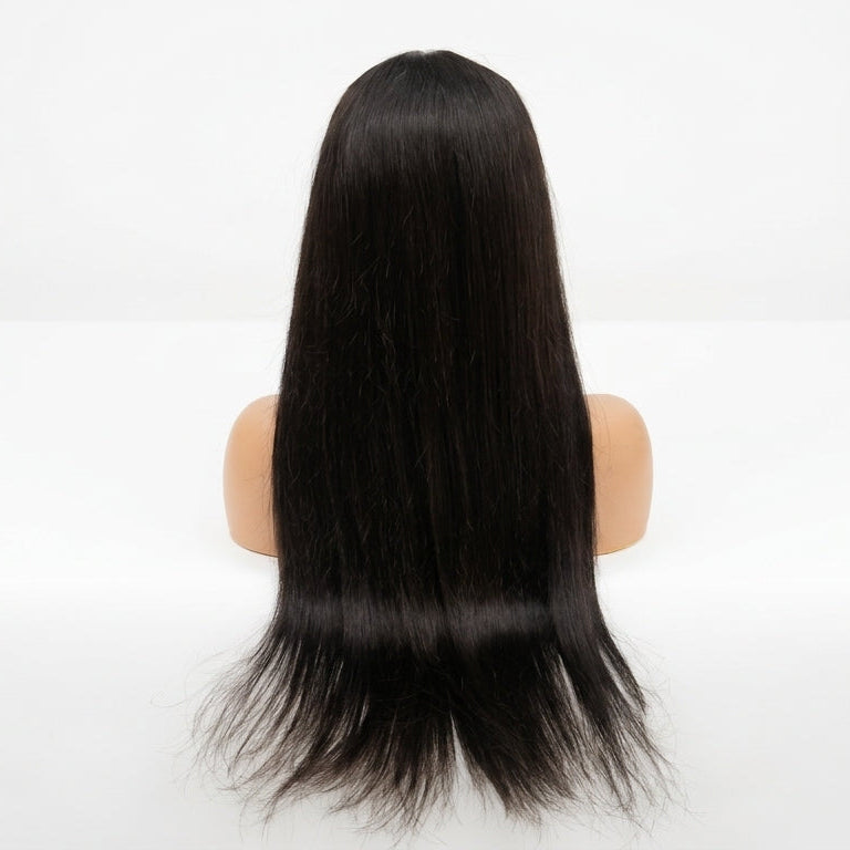 Close-up of a ready to wear glueless wig showing pre-plucked parting and natural density