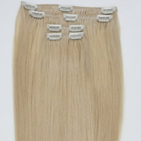 100 percent raw Vietnamese blonde clip in hair extensions set displayed on flat white background in Dubai UAE