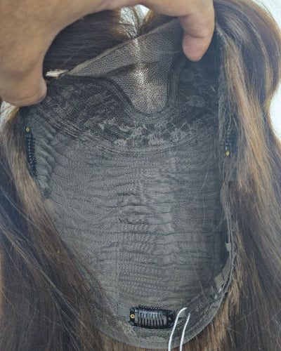 Model wears a dark brown Body Wave Wig with Bangs. Soft, bounced waves.