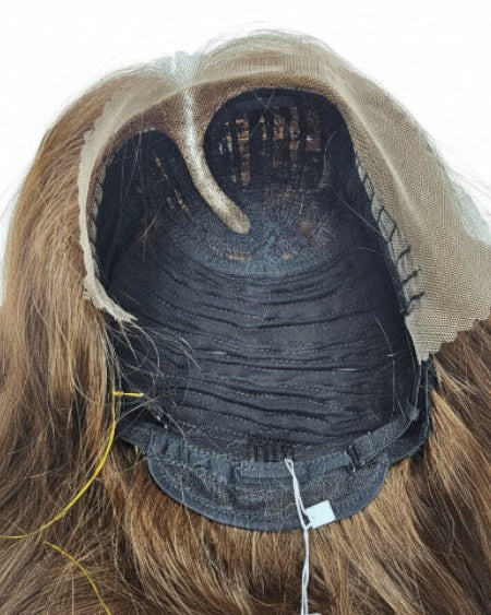Close-up of lace middle part on natural brown straight human hair wig