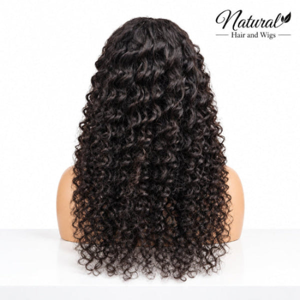 Curly human hair wig with fringe and natural-looking curls.