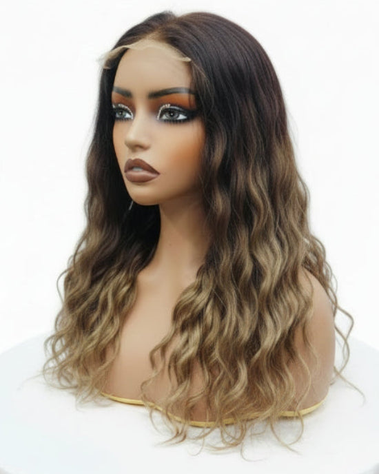 Side profile showing a Highlight Curly Wig featuring honey blonde streak dimension