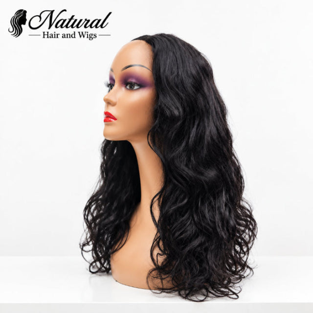 Stylist showing natural leave-out blend on a Wavy V Part Wig.