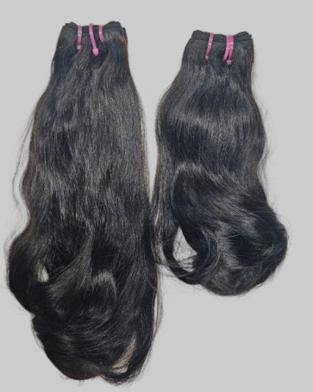 Funmi hair weave bundles with voluminous curls.