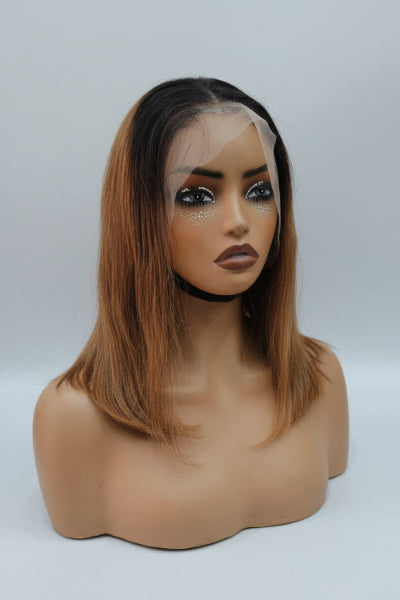 Shoulder-length lace front wig with dark brown roots and warm caramel-brown highlights. 
1B 4 Bob Wig UAE in black and brown human hair. 
1B 4 Bob Wig Dubai with shoulder length bob style