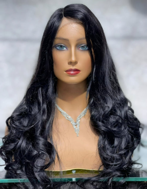 Model wearing a Centre Part Wavy Wig featuring symmetrical face-framing brown waves and full body volume.