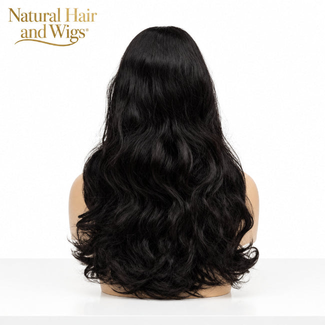 Stylist holding Wavy Glueless Wig Dubai to demonstrate zero-glue installation.