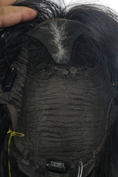 Sunlight hits a light brown Wavy Wig with Curtain Bangs, showing natural shine.