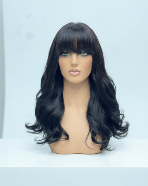 Wavy Wig with Curtain Bangs shown on model. High-quality human hair.
