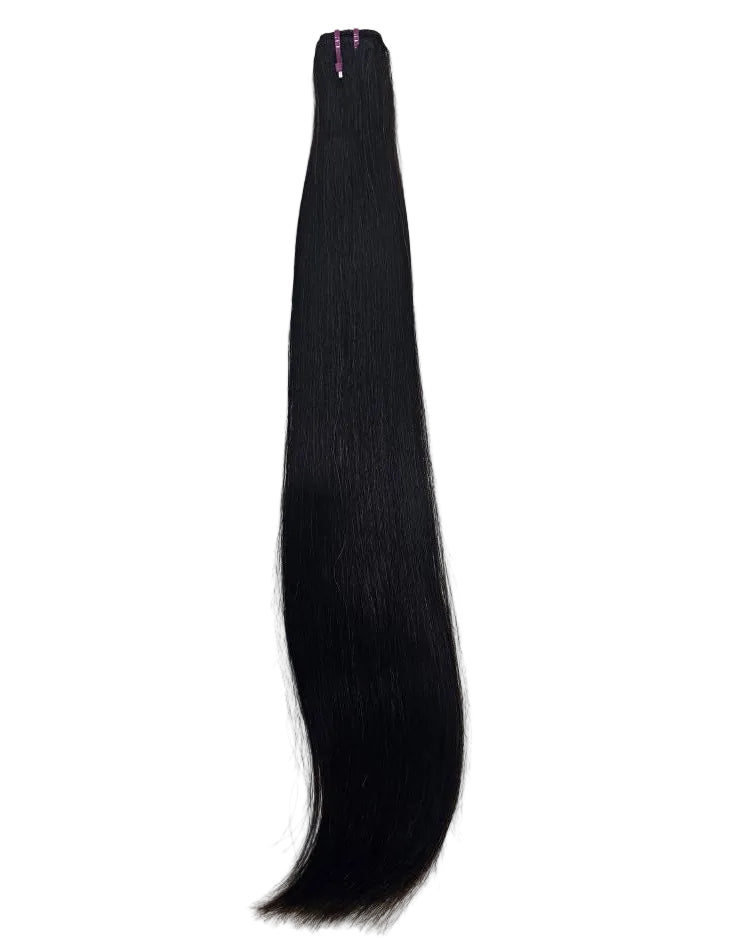 Professional hair extension installation using bone straight human hair wefts in Dubai salon